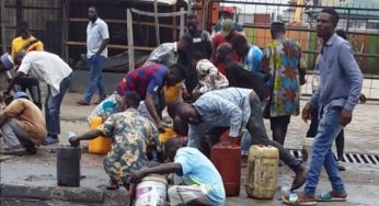 DANGER: Residents scoop fuel as petrol tanker falls in Lagos