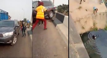 One way driver knocks police off bridge into Lagos canal (Video)