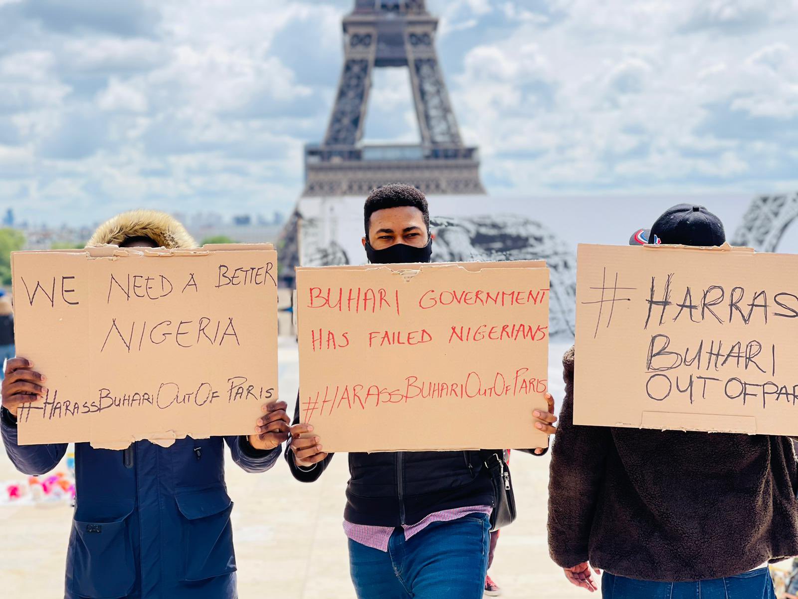 BREAKING: Nigerians harrass Buhari in Paris, France