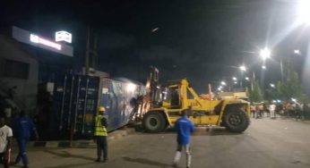 Four trapped in crushed vehicle as container falls off Ojuelegba bridge in Lagos