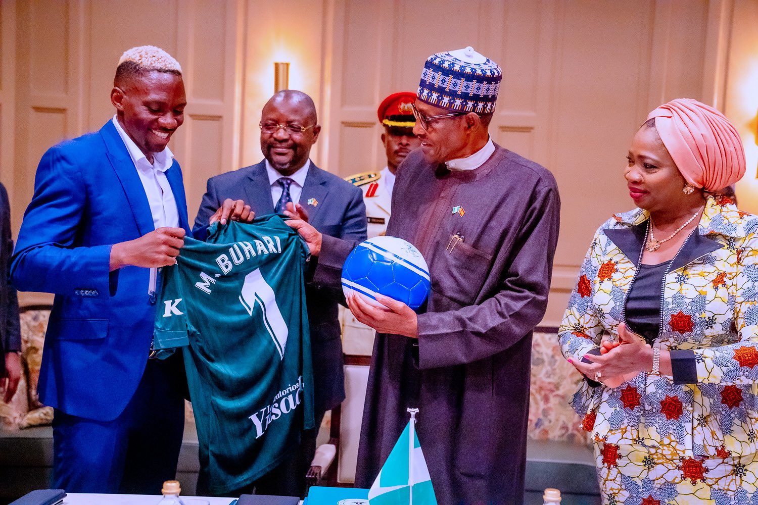 Omeruo meets, presents signed jersey to Buhari in Spain
