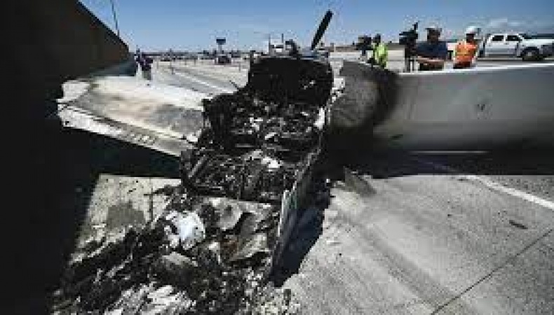 Plane crashes into truck, catches fire