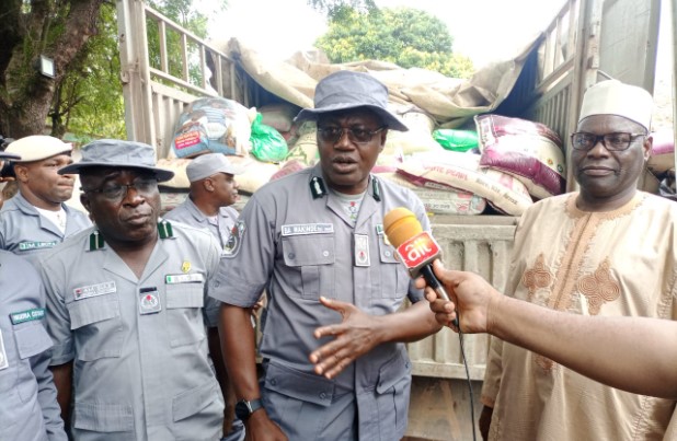 Dangote trucks, 21 others loaded with foreign rice hidden within bags of cement impounded