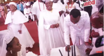 Deborah Enenche and her husband, Sam Uloko sign marriage register