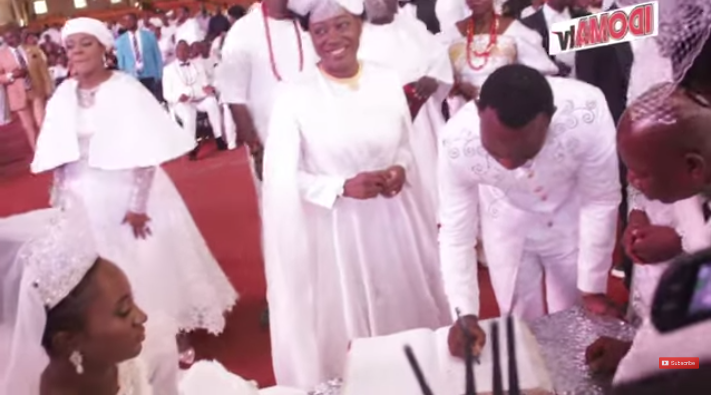 Deborah Enenche and her husband, Sam Uloko sign marriage register