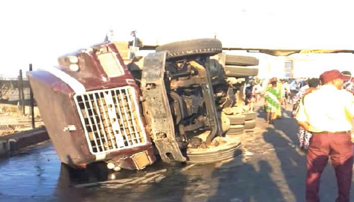 Driver survives after container truck overturns in Lagos